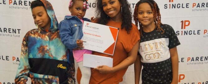 Single mom with her kids stands in front of an ASPSF banner.