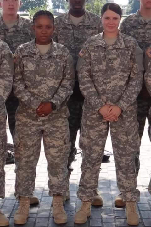 Group of miltary people in camo.