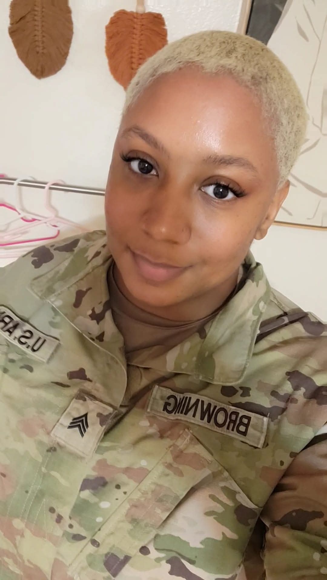 Kristy dressed in camo in a selfie.