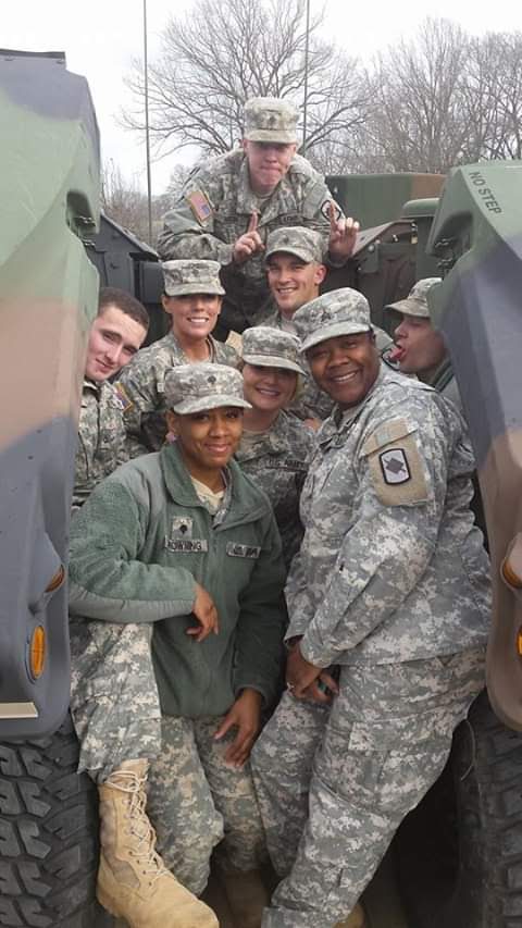 Group of miltary people in camo.