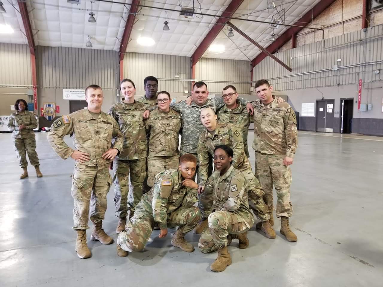 Group of miltary people in camo.