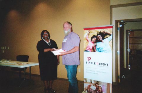ASPSF Recipient Gary Thompson receives his Fall 2024 Scholarship from a volunteer