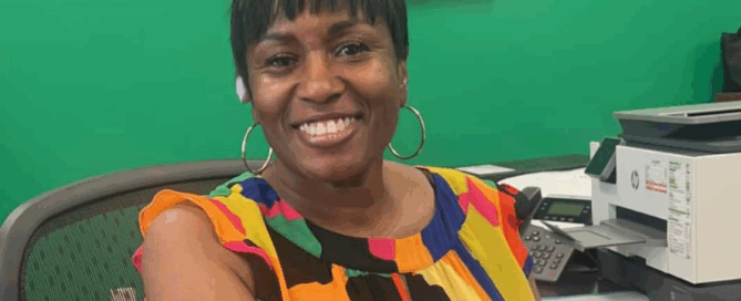 ASPSF Volunteer of the Month Carla McFadden sits at a desk
