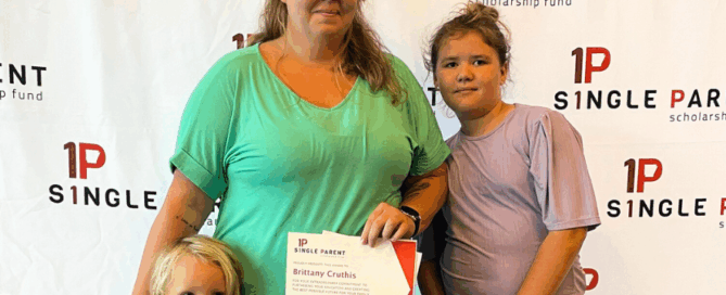 Brittany accepts her scholarship award
