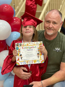 Gary Thompson with his daughter who is graduating kindergarden