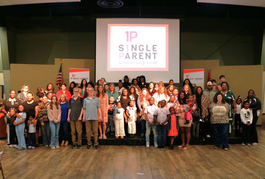 Group photo of scholarship recipients and their families
