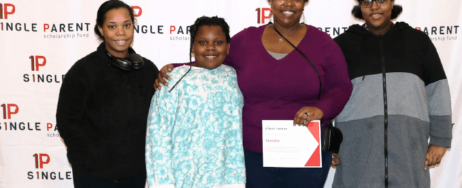Ronisha Niki Baker holds her scholarship award from ASPSF surrouned by her three daughters