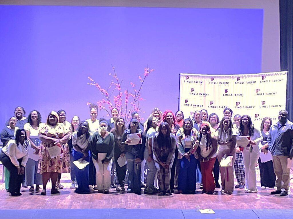 Group of single parents on a stage
