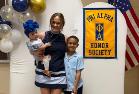 Kayla Coady with her two children at the Phi Alpha Induction Ceremony
