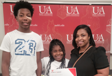 Daneshia Cherry and her two kids at an ASPSF Scholarship Ceremony
