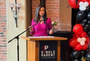 Donna Terrell speaks at a podium.