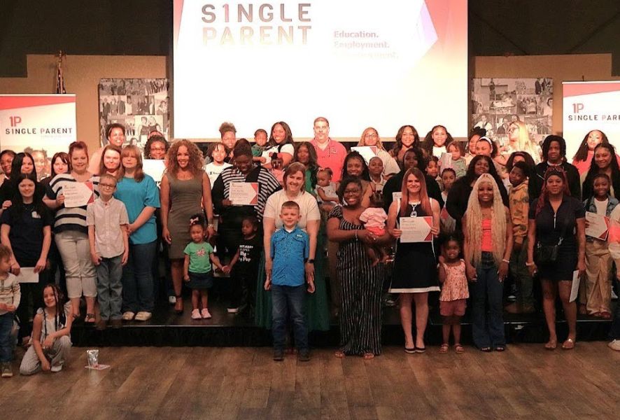 Group of aspsf reciepients and their families at a ceremony